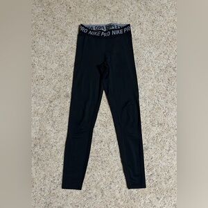 Women’s Nike Pro Dri-Fit leggings, swoosh logo on leg, size S.